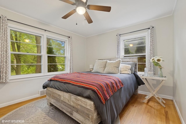 431 Elm Ave, Geneva, IL 60134 - bedroom with wood finished floors, baseboards, ornamental molding, and a ceiling fan