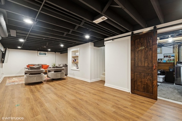 431 Elm Ave, Geneva, IL 60134 - finished basement with wood finished floors, baseboards, and a barn door