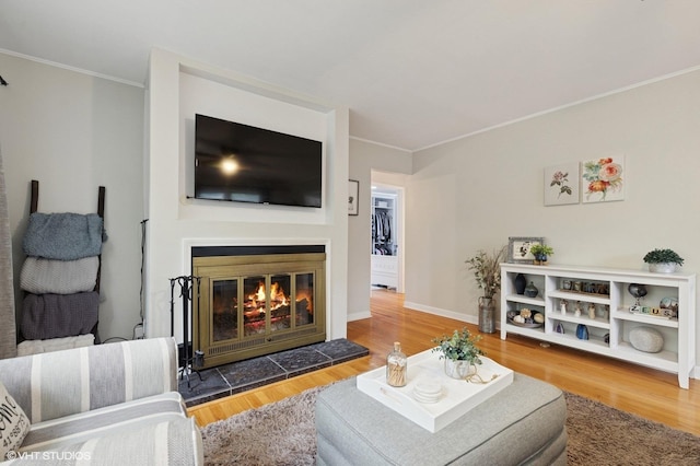 431 Elm Ave, Geneva, IL 60134 - living room with ornamental molding, a fireplace, wood finished floors, and baseboards