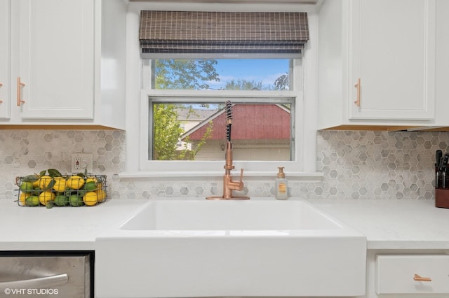 431 Elm Ave, Geneva, IL 60134 - kitchen featuring white cabinetry, light countertops, a sink, and dishwasher