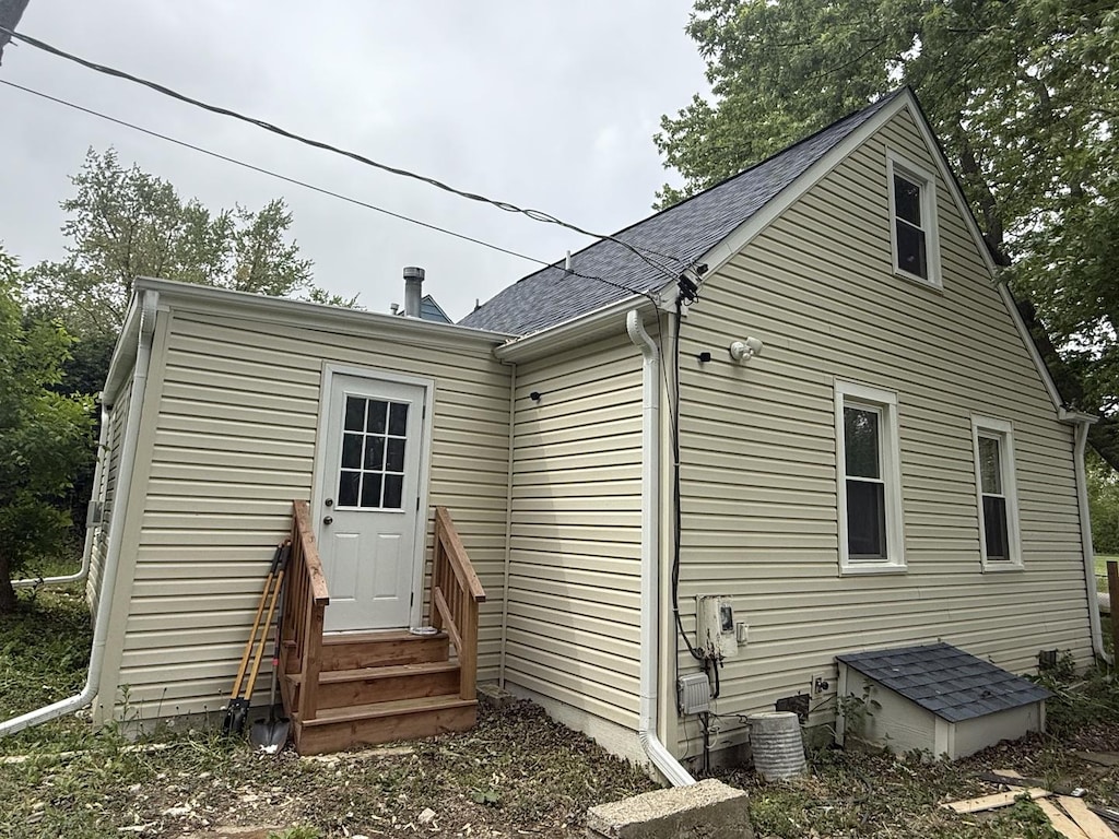 1623 Beverly Dr, Round Lake Beach, IL 60073 - rear view of property featuring a shingled roof and central air condition unit