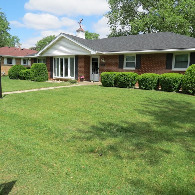 206 Vermont St, Momence, IL 60954 - single story home with brick siding and a front lawn