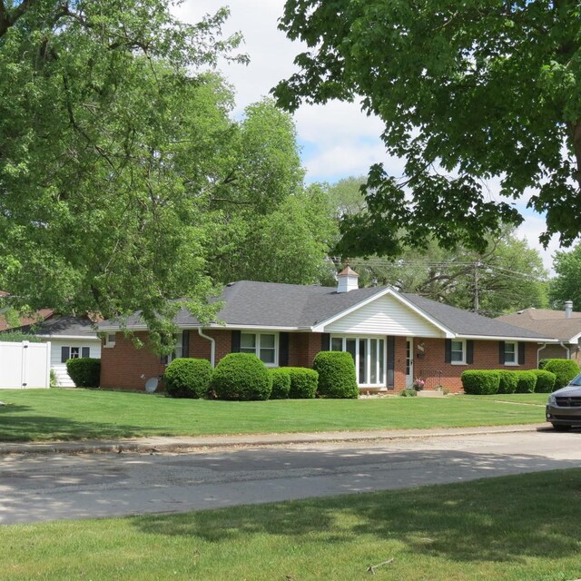 206 Vermont St, Momence, IL 60954 - single story home featuring brick siding and a chimney