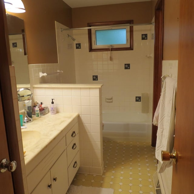 206 Vermont St, Momence, IL 60954 - full bath with tile walls, vanity, shower / washtub combination, tile patterned flooring, and wainscoting
