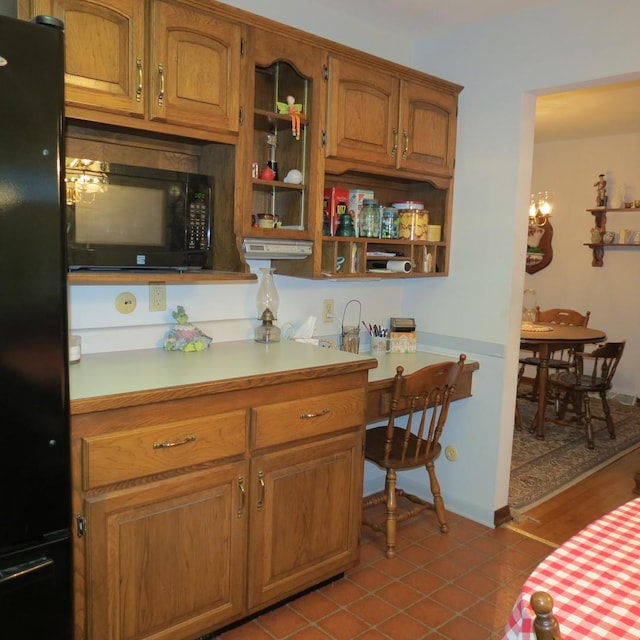 206 Vermont St, Momence, IL 60954 - kitchen featuring black appliances, light countertops, and brown cabinets