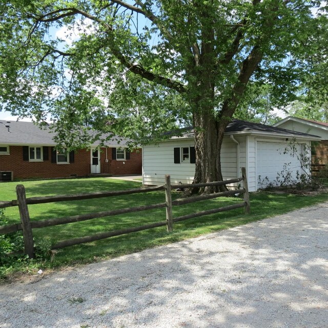 206 Vermont St, Momence, IL 60954 - ranch-style home with driveway and an attached garage