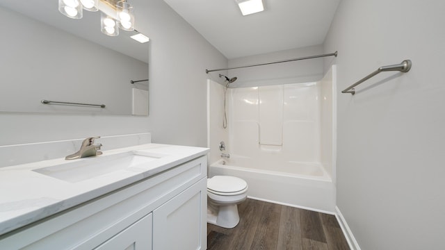 677 Southtowne Dr Unit 1, Belvidere, IL 61008 - full bathroom featuring wood finished floors, toilet, vanity, and tub / shower combination