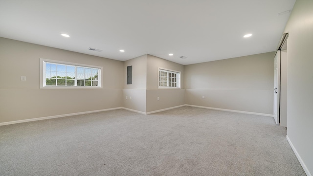 677 Southtowne Dr Unit 1, Belvidere, IL 61008 - unfurnished room with light carpet, baseboards, and recessed lighting