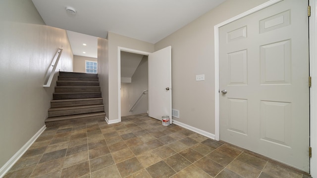 677 Southtowne Dr Unit 1, Belvidere, IL 61008 - staircase featuring baseboards, stone finish floors, and recessed lighting