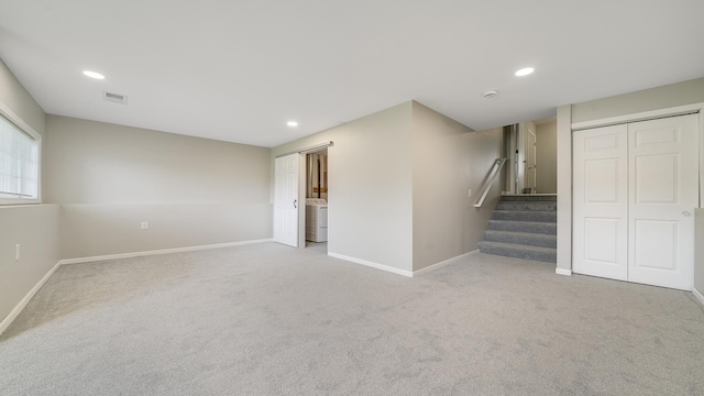 677 Southtowne Dr Unit 1, Belvidere, IL 61008 - basement with stairway, carpet floors, baseboards, washer / dryer, and recessed lighting