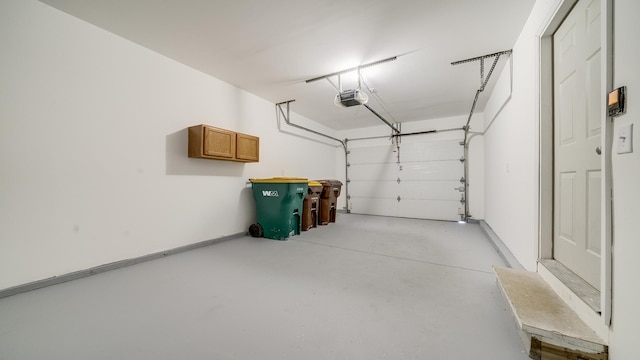 677 Southtowne Dr Unit 1, Belvidere, IL 61008 - garage featuring a garage door opener