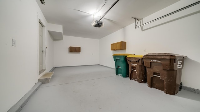 677 Southtowne Dr Unit 1, Belvidere, IL 61008 - garage featuring a garage door opener