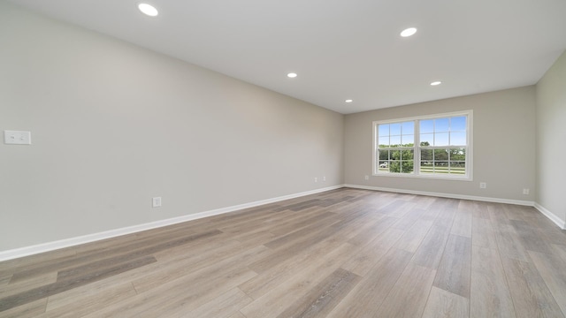 677 Southtowne Dr Unit 1, Belvidere, IL 61008 - empty room featuring wood finished floors, baseboards, and recessed lighting