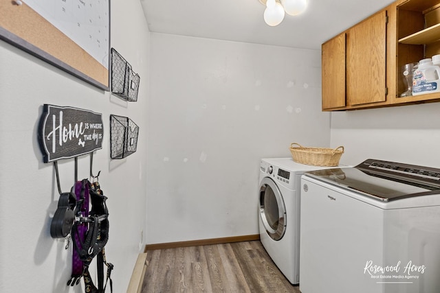 125 E Second S St, Chebanse, IL 60922 - laundry area with separate washer and dryer, cabinet space, light wood finished floors, and baseboards