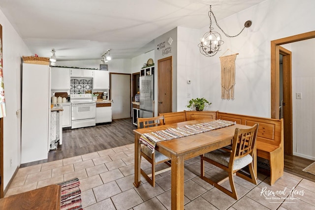 125 E Second S St, Chebanse, IL 60922 - dining area featuring a chandelier, light tile patterned flooring, and rail lighting