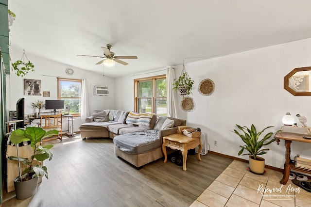 125 E Second S St, Chebanse, IL 60922 - living area with a ceiling fan, healthy amount of natural light, a wall mounted air conditioner, and wood finished floors