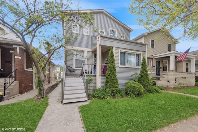 5351 N Kimball Ave, Chicago, IL 60625 - view of front of property with a front lawn and a porch