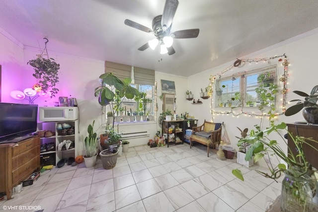 5351 N Kimball Ave, Chicago, IL 60625 - living area featuring a ceiling fan, marble finish floors, and a baseboard radiator