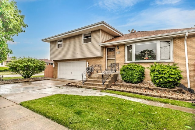 5938 W 83rd St, Burbank, IL 60459 - split level home with brick siding, concrete driveway, an attached garage, and a front yard