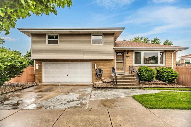 5938 W 83rd St, Burbank, IL 60459 - split level home featuring brick siding, an attached garage, and driveway
