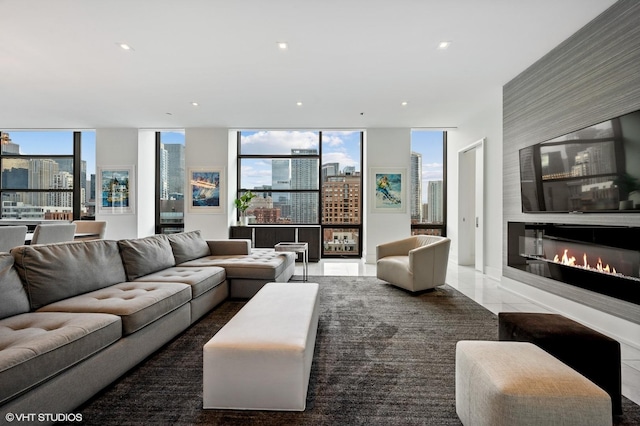 400 W Huron St Unit 1001, Chicago, IL 60654 - living area featuring a skyline view, floor to ceiling windows, a large fireplace, and recessed lighting