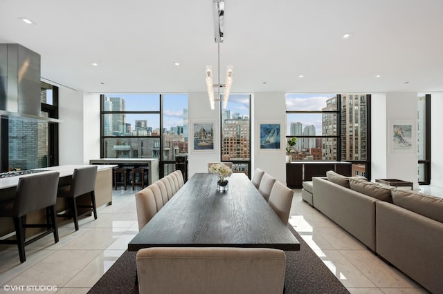 400 W Huron St Unit 1001, Chicago, IL 60654 - dining area featuring a skyline view, a wall of windows, recessed lighting, and light tile patterned floors