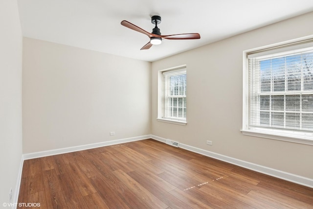 2028 Creekside Dr, Wheaton, IL 60189 - spare room with wood finished floors, ceiling fan, and baseboards