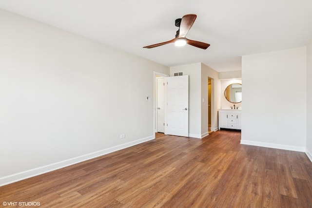 2028 Creekside Dr, Wheaton, IL 60189 - unfurnished bedroom with baseboards, wood finished floors, a sink, and ensuite bathroom