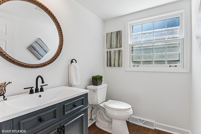 2028 Creekside Dr, Wheaton, IL 60189 - half bathroom with toilet, baseboards, wood finished floors, and vanity