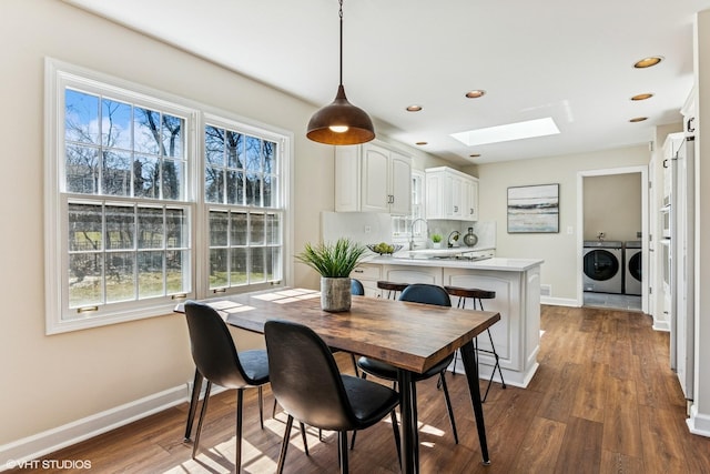 2028 Creekside Dr, Wheaton, IL 60189 - dining space featuring a skylight, washer and clothes dryer, baseboards, dark wood-style floors, and recessed lighting