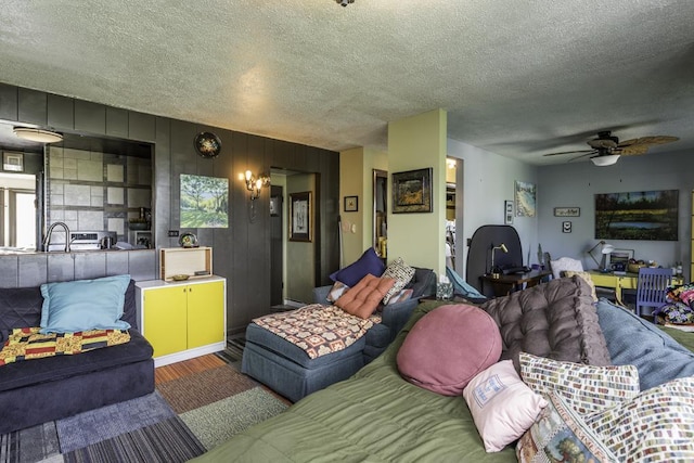 1311 Eastview Dr, Waukegan, IL 60085 - living area with wood finished floors, a ceiling fan, and a textured ceiling