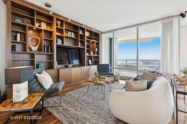 340 E Randolph St Unit 4806, Chicago, IL 60601 - living area with a wall of windows, wood finished floors, and rail lighting