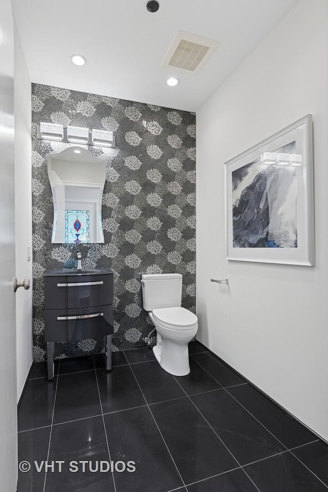 340 E Randolph St Unit 4806, Chicago, IL 60601 - bathroom with wallpapered walls, toilet, vanity, tile patterned flooring, and recessed lighting