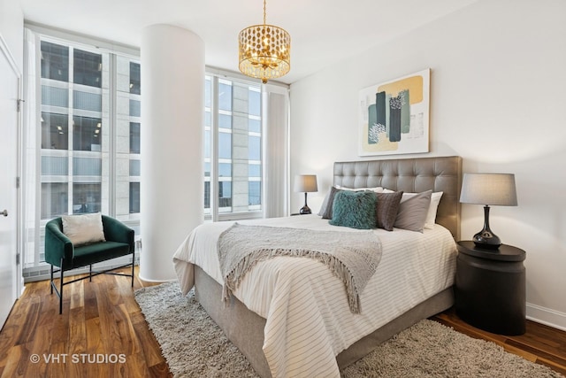 340 E Randolph St Unit 4806, Chicago, IL 60601 - bedroom with wood finished floors and a chandelier