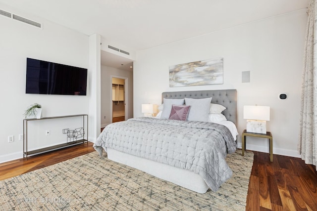 340 E Randolph St Unit 4806, Chicago, IL 60601 - bedroom featuring wood finished floors, baseboards, and a walk in closet