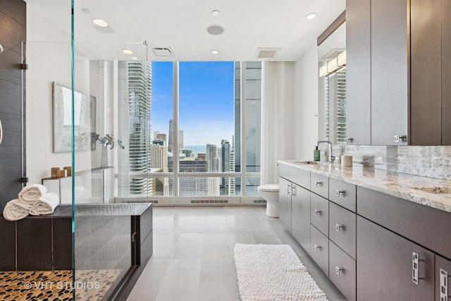 340 E Randolph St Unit 4806, Chicago, IL 60601 - full bathroom featuring floor to ceiling windows, plenty of natural light, tiled shower, toilet, and vanity