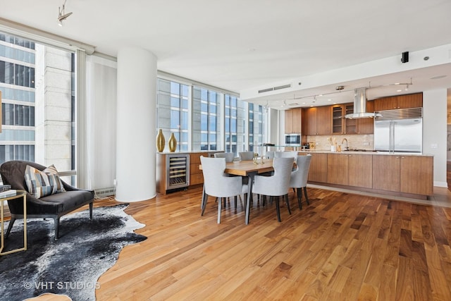 340 E Randolph St Unit 4806, Chicago, IL 60601 - dining room featuring wine cooler and light wood finished floors