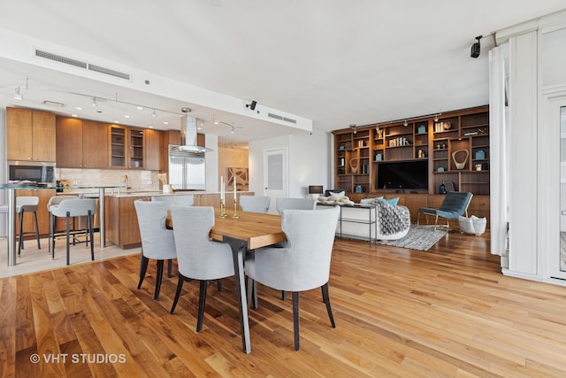 340 E Randolph St Unit 4806, Chicago, IL 60601 - dining area with track lighting and light wood finished floors