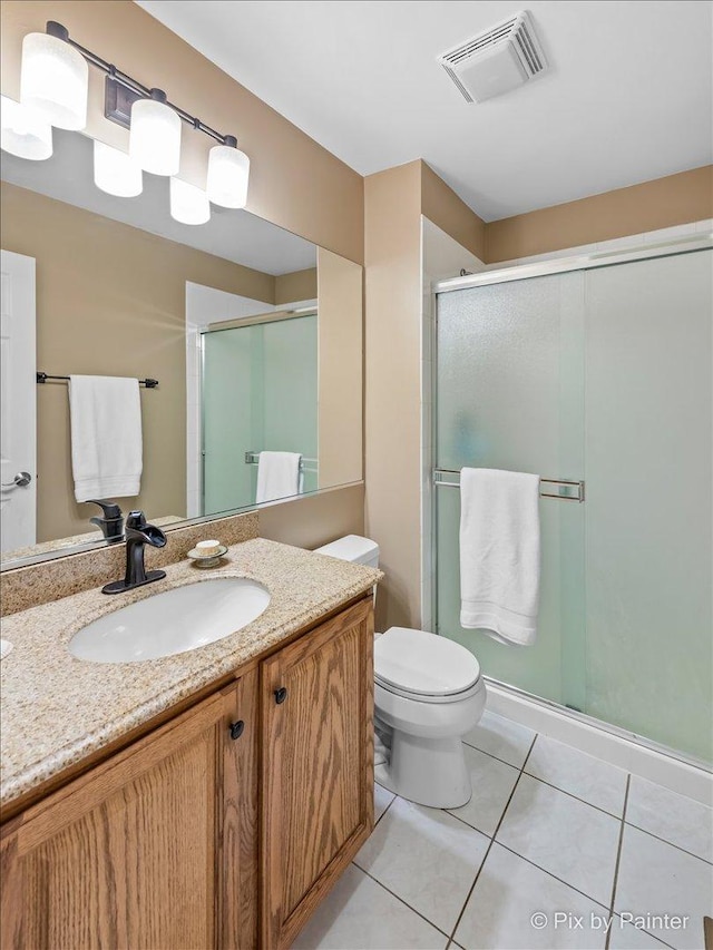 553 S Haverhill Ln, South Elgin, IL 60177 - full bathroom featuring tile patterned flooring, vanity, a shower stall, and toilet