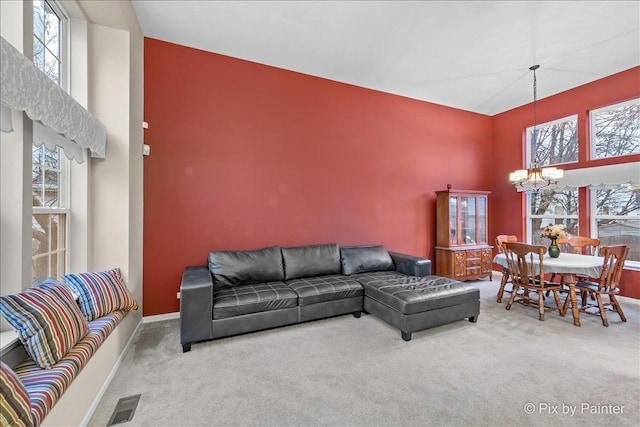553 S Haverhill Ln, South Elgin, IL 60177 - living area featuring a chandelier, carpet, a towering ceiling, and baseboards