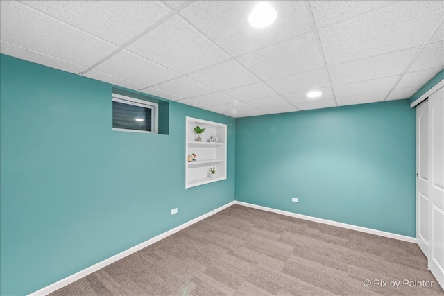553 S Haverhill Ln, South Elgin, IL 60177 - spare room with built in features, baseboards, carpet flooring, and a drop ceiling