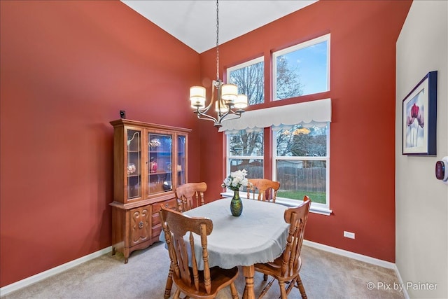 553 S Haverhill Ln, South Elgin, IL 60177 - dining area with a chandelier, light carpet, baseboards, and high vaulted ceiling