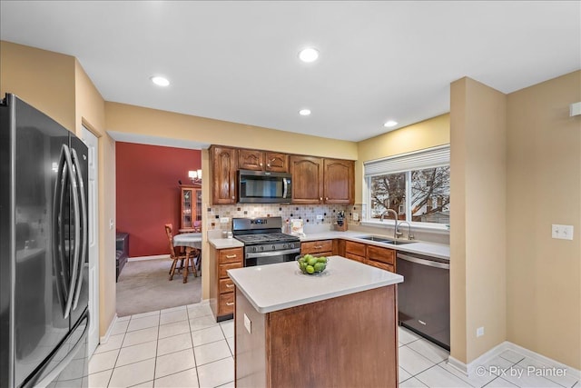 553 S Haverhill Ln, South Elgin, IL 60177 - kitchen with stainless steel appliances, a sink, light countertops, baseboards, and decorative backsplash