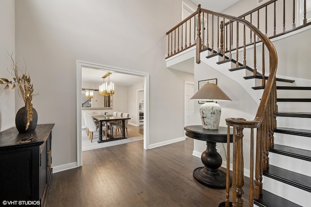 4141 Rutgers Ln, Northbrook, IL 60062 - staircase featuring a high ceiling, a chandelier, wood finished floors, and baseboards