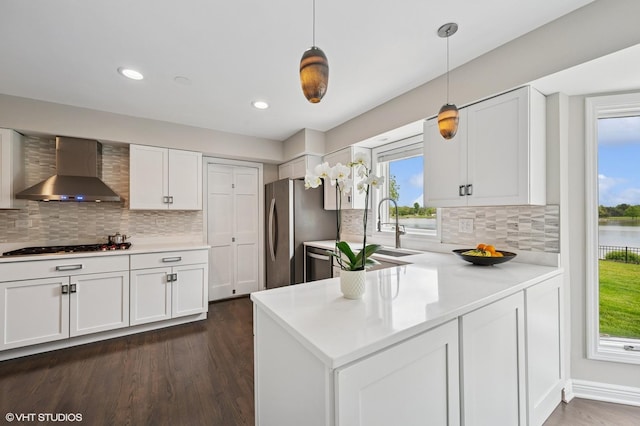 4141 Rutgers Ln, Northbrook, IL 60062 - kitchen with wall chimney range hood, freestanding refrigerator, white cabinets, dark wood-style flooring, and a sink
