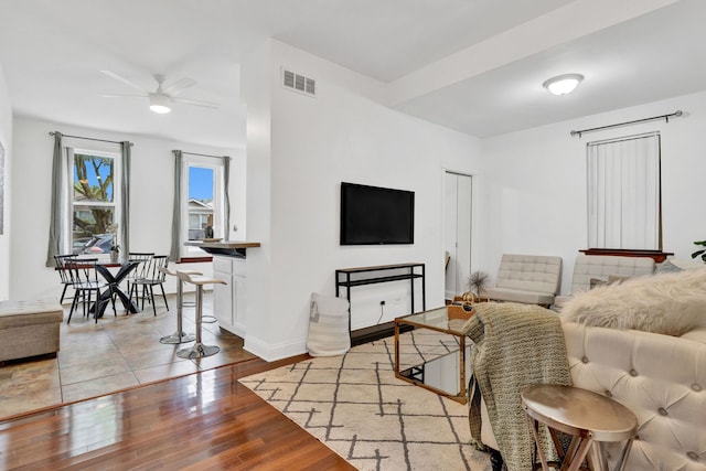 918 W 35th Pl, Chicago, IL 60609 - living room with a ceiling fan, wood finished floors, and baseboards