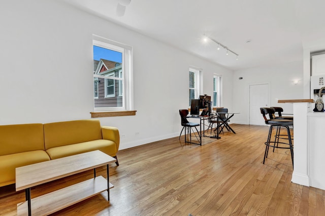 918 W 35th Pl, Chicago, IL 60609 - living area with light wood-type flooring, track lighting, and baseboards