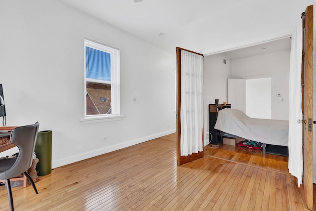 918 W 35th Pl, Chicago, IL 60609 - bedroom featuring hardwood / wood-style floors, an office area, and baseboards