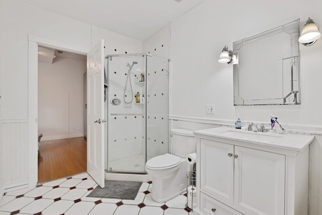 918 W 35th Pl, Chicago, IL 60609 - full bath featuring a shower stall, toilet, vanity, wainscoting, and tile patterned floors
