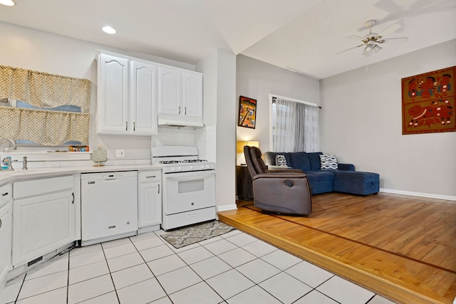 918 W 35th Pl, Chicago, IL 60609 - kitchen with white appliances, under cabinet range hood, light countertops, white cabinetry, and ceiling fan